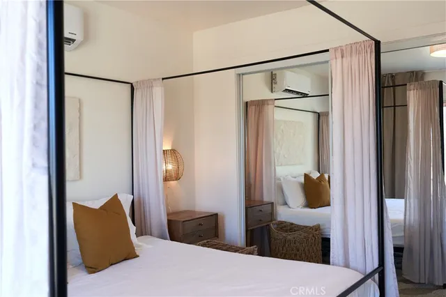 a view of a dining room with furniture and a chandelier