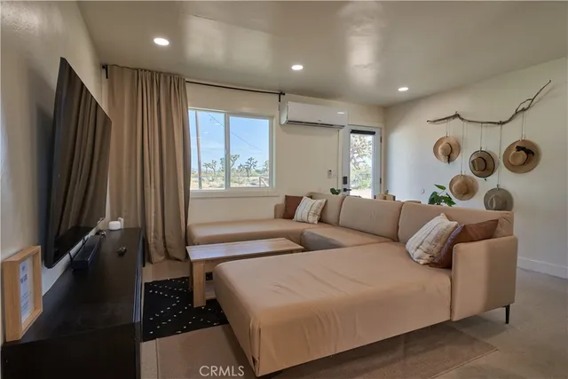 a bedroom with a bed and a lamp