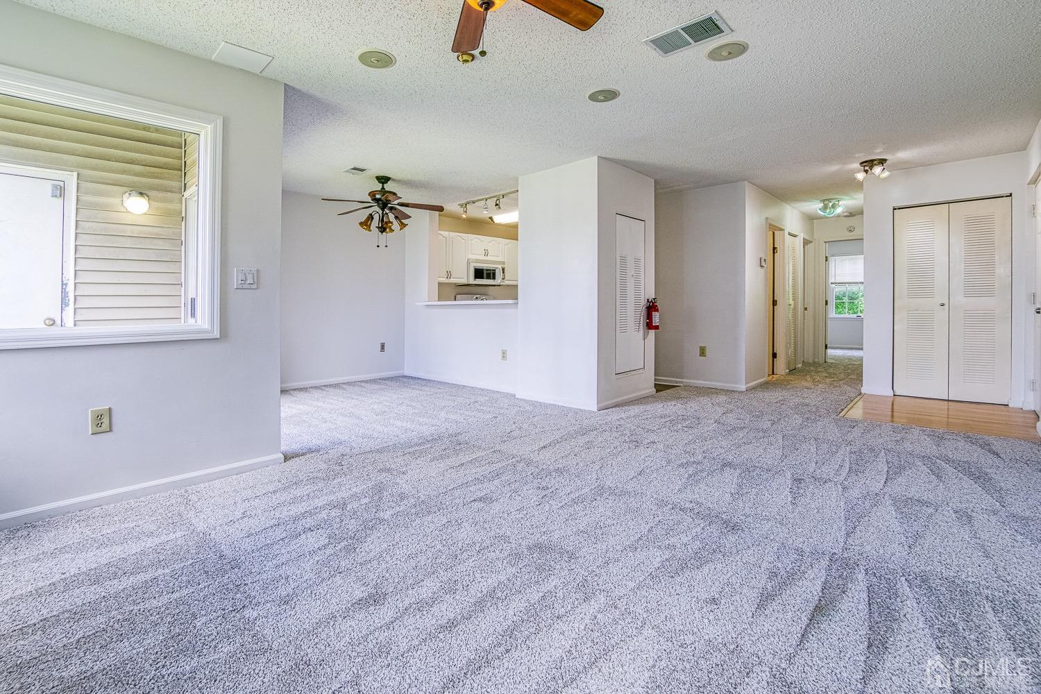 520 Edpas Road New Brunswick, NJ 08901 - Photo 6 of 15 an empty room with fan and windows