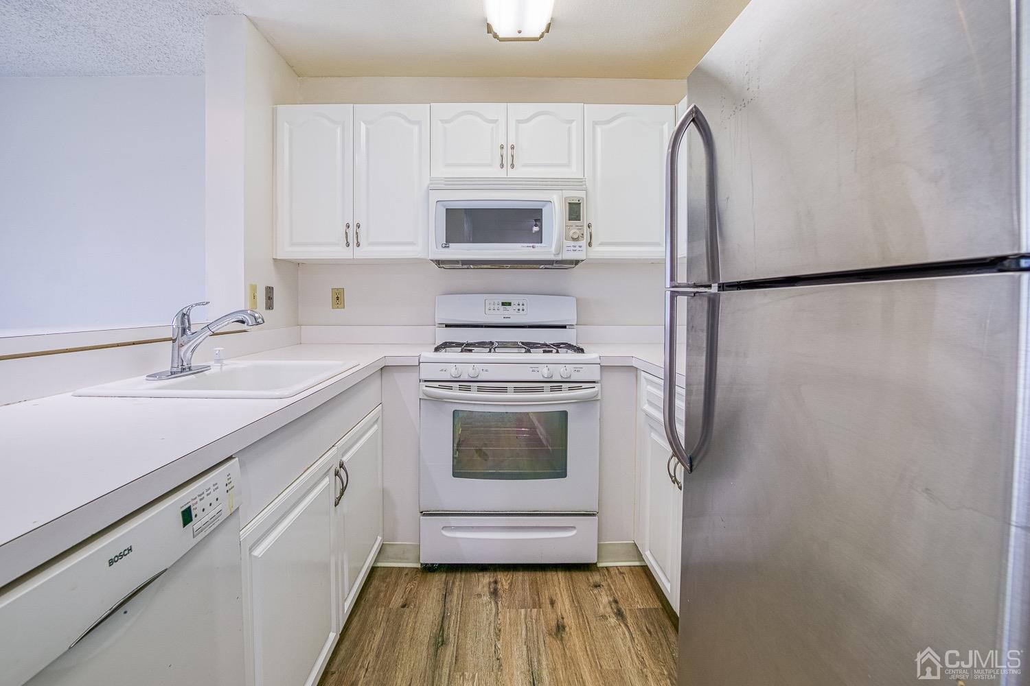 520 Edpas Road New Brunswick, NJ 08901 - Photo 8 of 15 a kitchen with a sink stove and refrigerator
