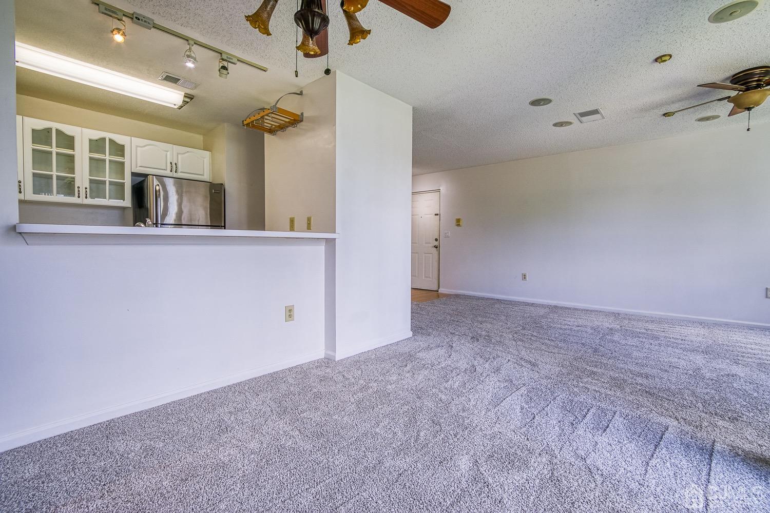 520 Edpas Road New Brunswick, NJ 08901 - Photo 9 of 15 an empty room with a ceiling fan and window