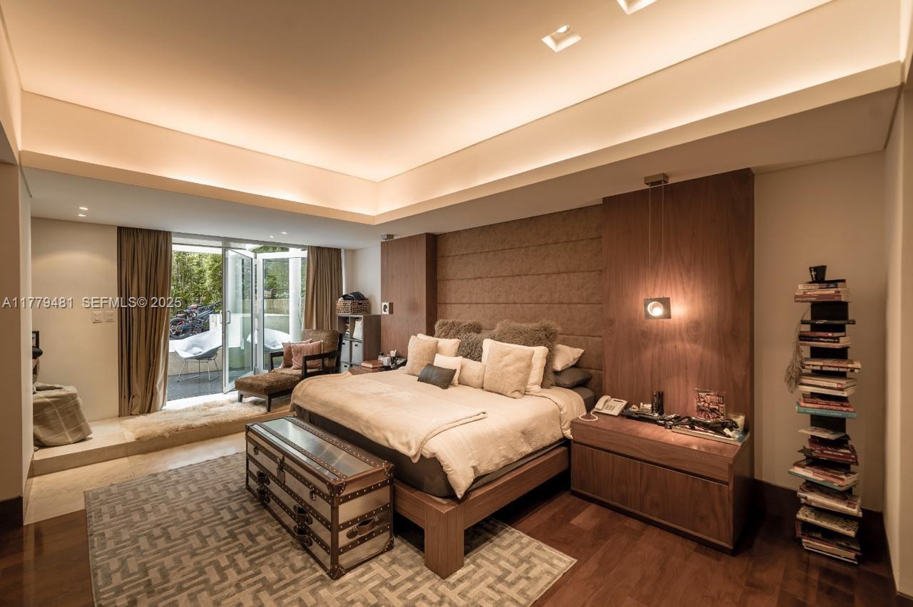 undefined, FL 11000 - Photo 13 of 27 a bedroom with a bed and a night stand