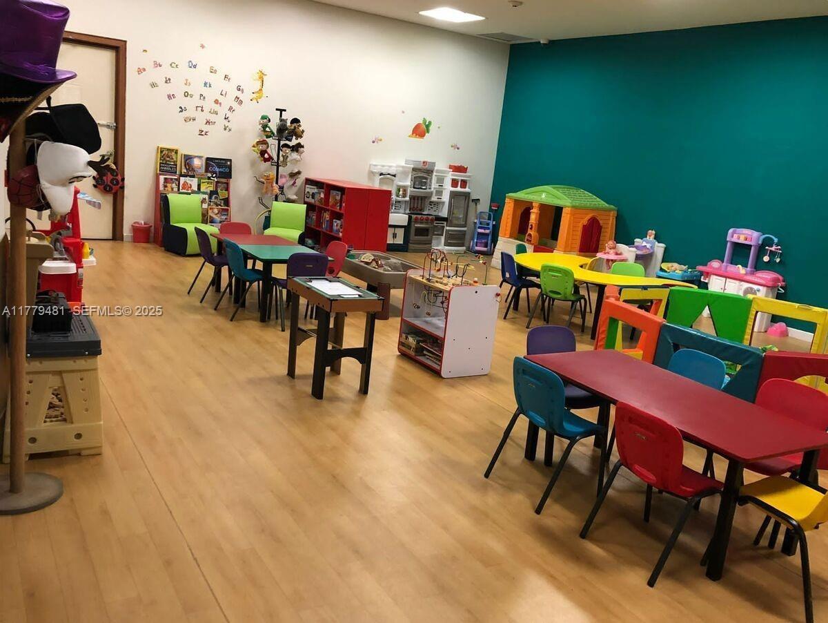 undefined, FL 11000 - Photo 20 of 27 a view of a dining room with furniture and a chandelier