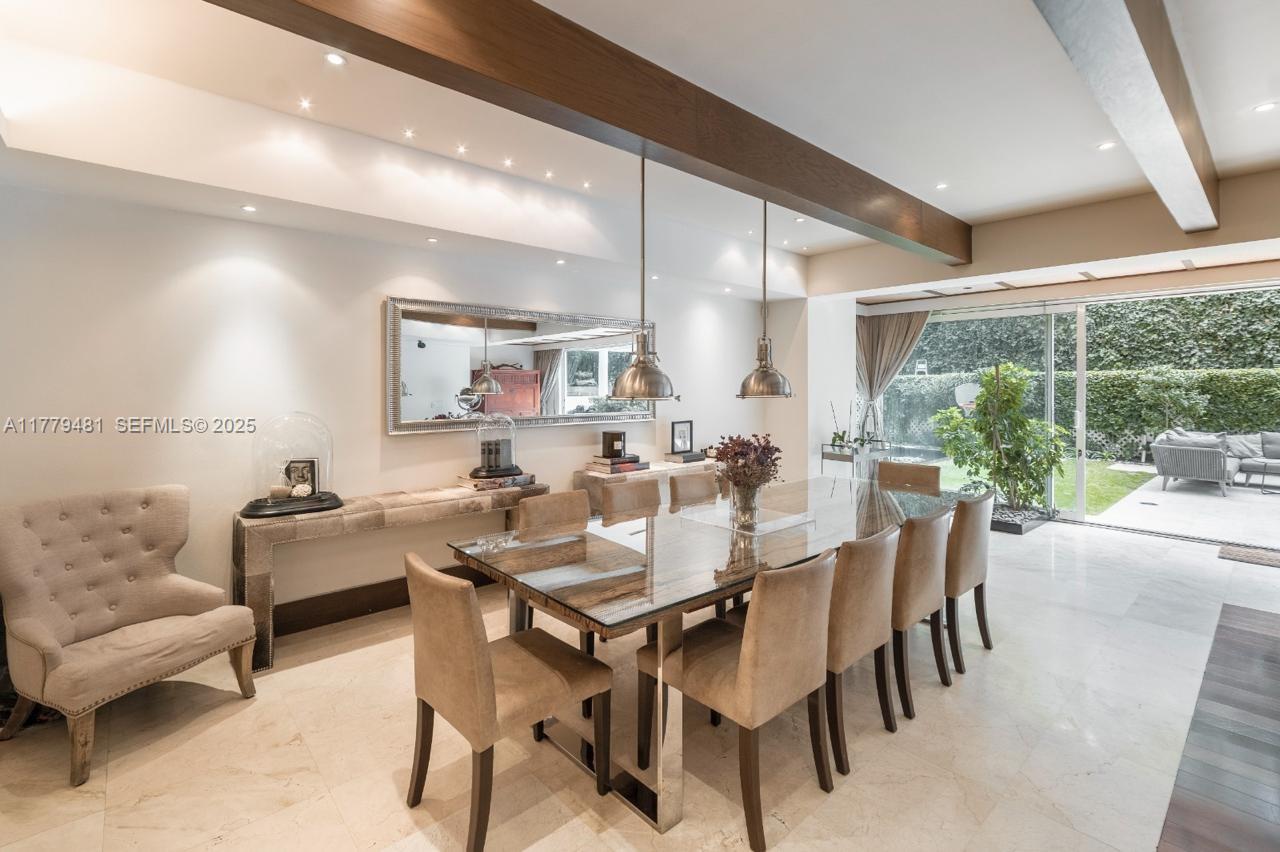 undefined, FL 11000 - Photo 4 of 27 a dining room with furniture and a large window