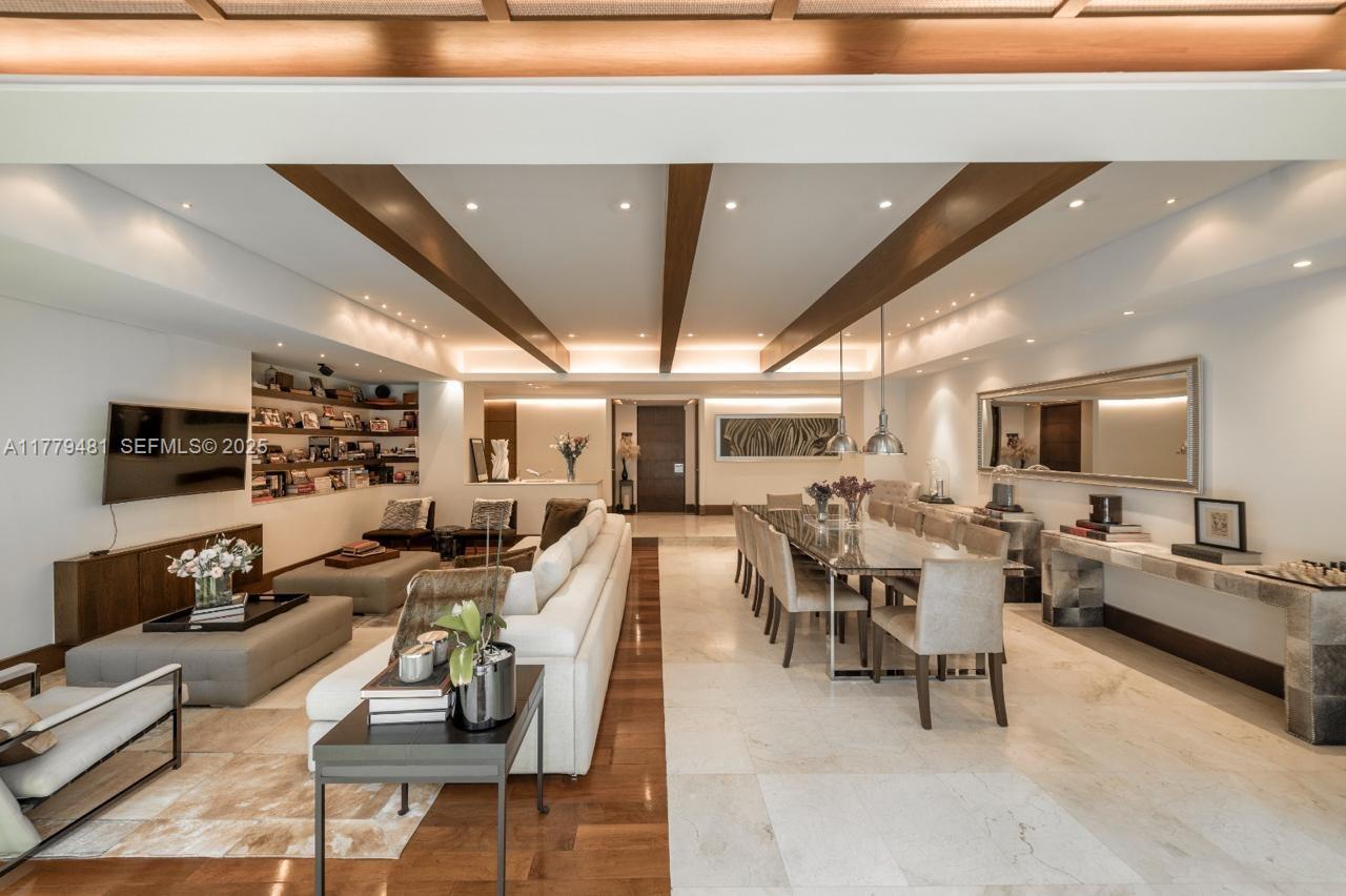 undefined, FL 11000 - Photo 5 of 27 a living room with lots of furniture and a flat screen tv