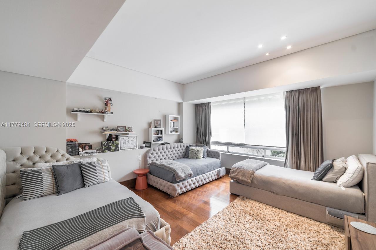 undefined, FL 11000 - Photo 7 of 27 a living room with furniture and a large window