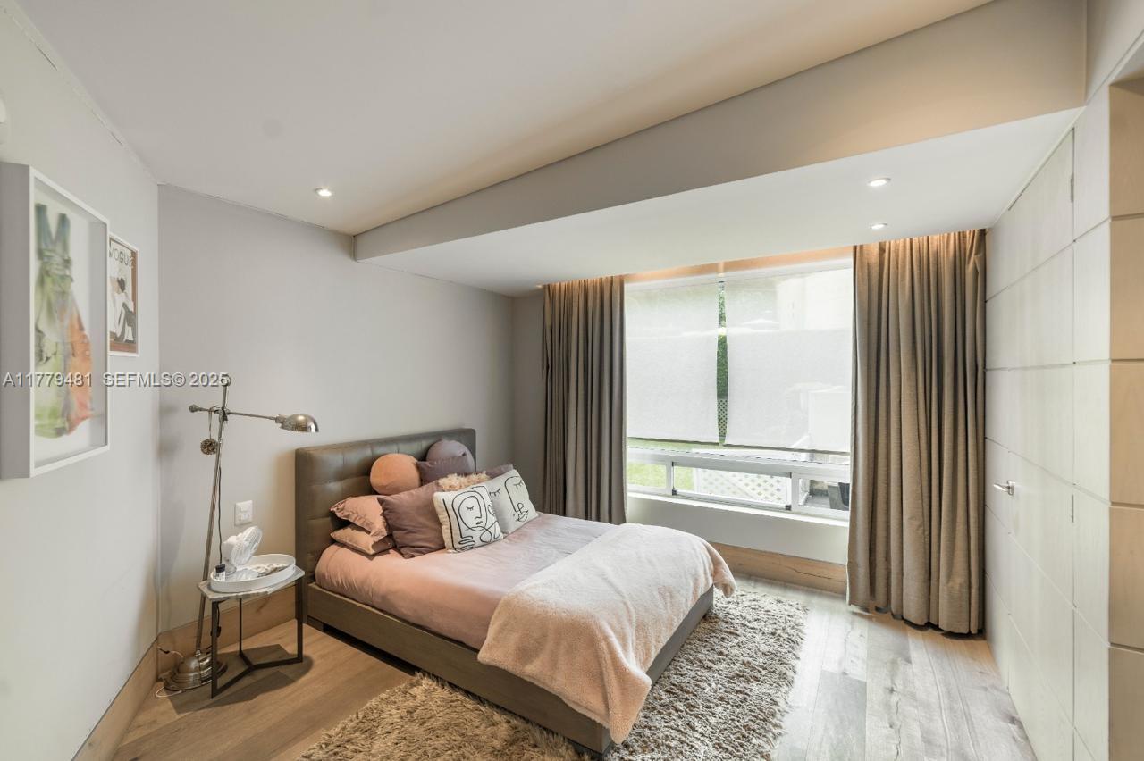 undefined, FL 11000 - Photo 8 of 27 a bedroom with a bed and a window