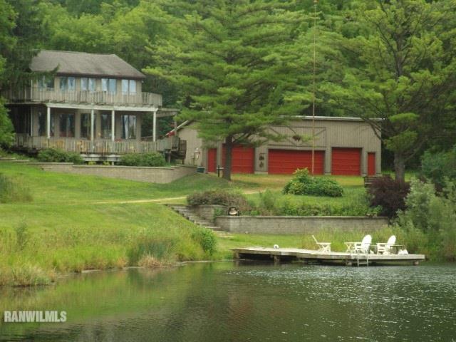 5665 South Blanding Road Hanover, IL 61041 - Photo 1 of 29 a view of a house with a swimming pool