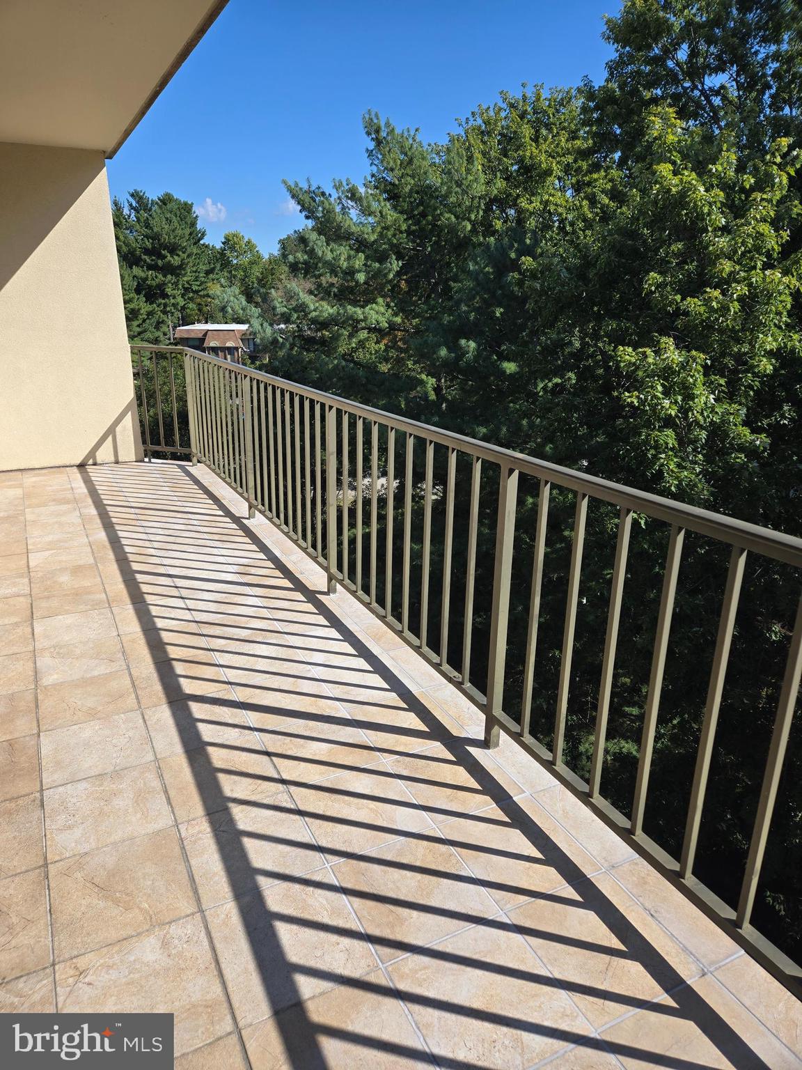 1000 Putnam Boulevard, Unit 603 Wallingford, PA 19086 - Photo 13 of 44 a view of balcony with wooden floor and fence
