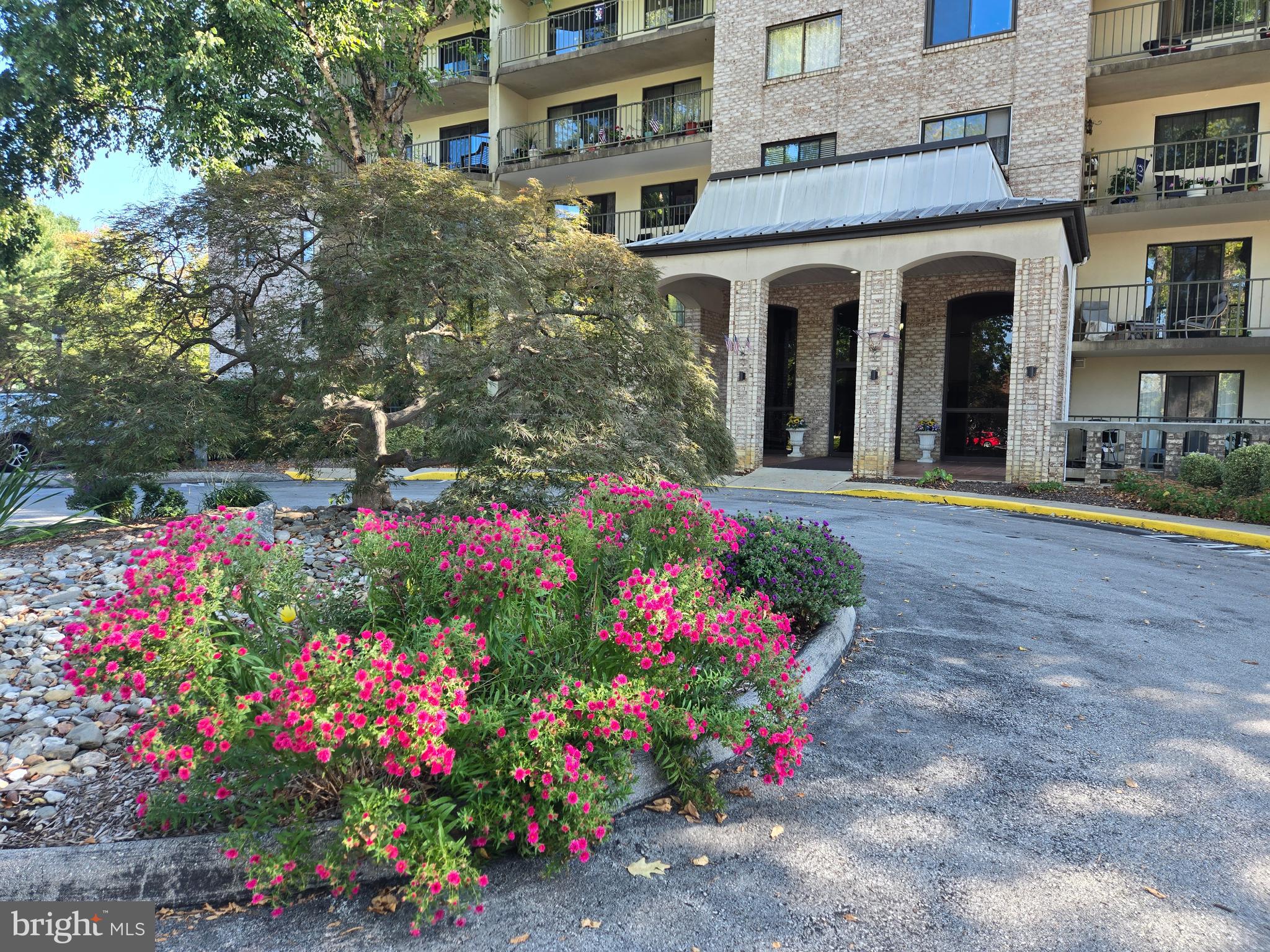 1000 Putnam Boulevard, Unit 603 Wallingford, PA 19086 - Photo 2 of 44 a front view of a multi story residential apartment building