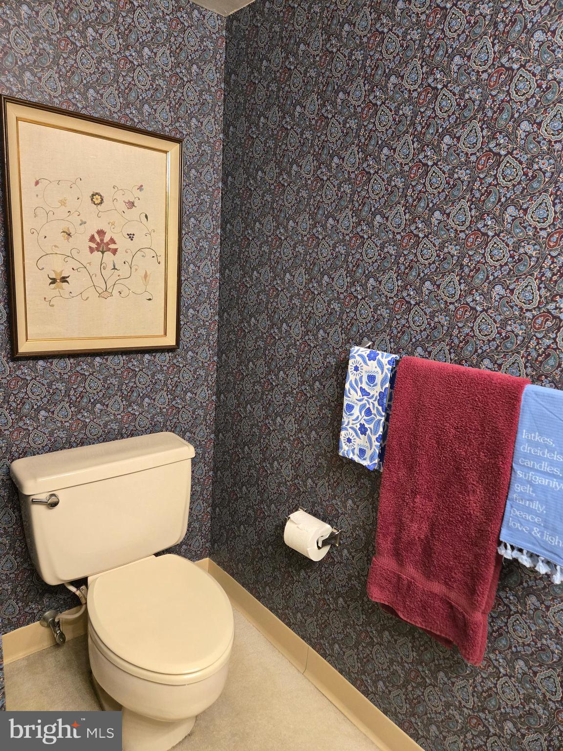 1000 Putnam Boulevard, Unit 603 Wallingford, PA 19086 - Photo 37 of 44 a white toilet sitting next to a bathroom sink