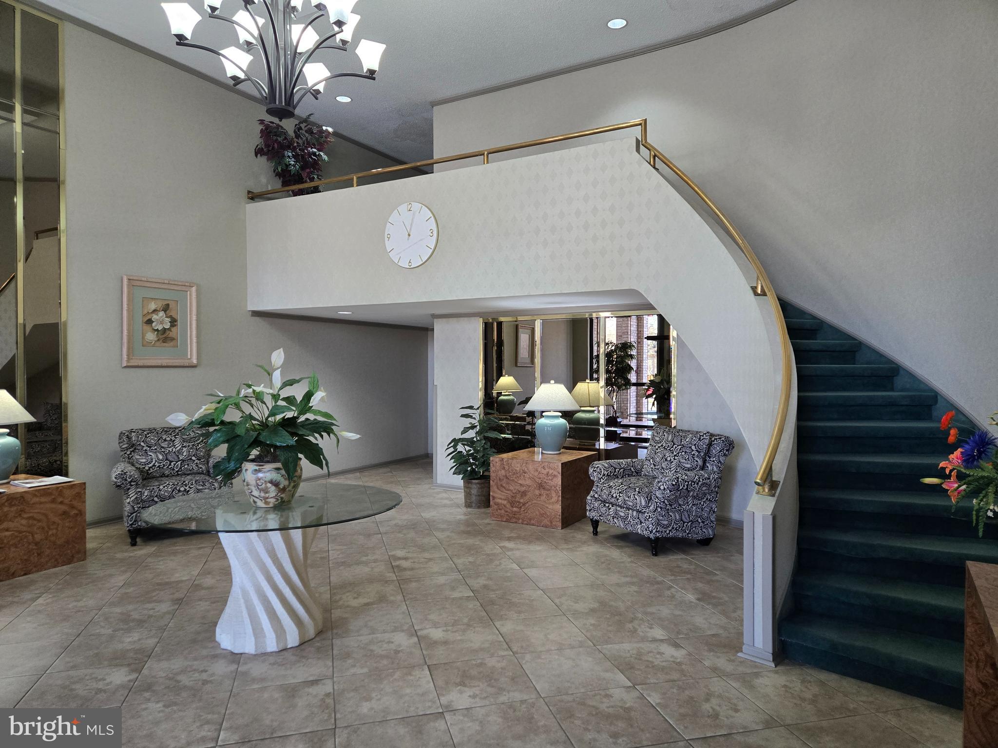 1000 Putnam Boulevard, Unit 603 Wallingford, PA 19086 - Photo 5 of 44 a view of living room filled with furniture and flowers