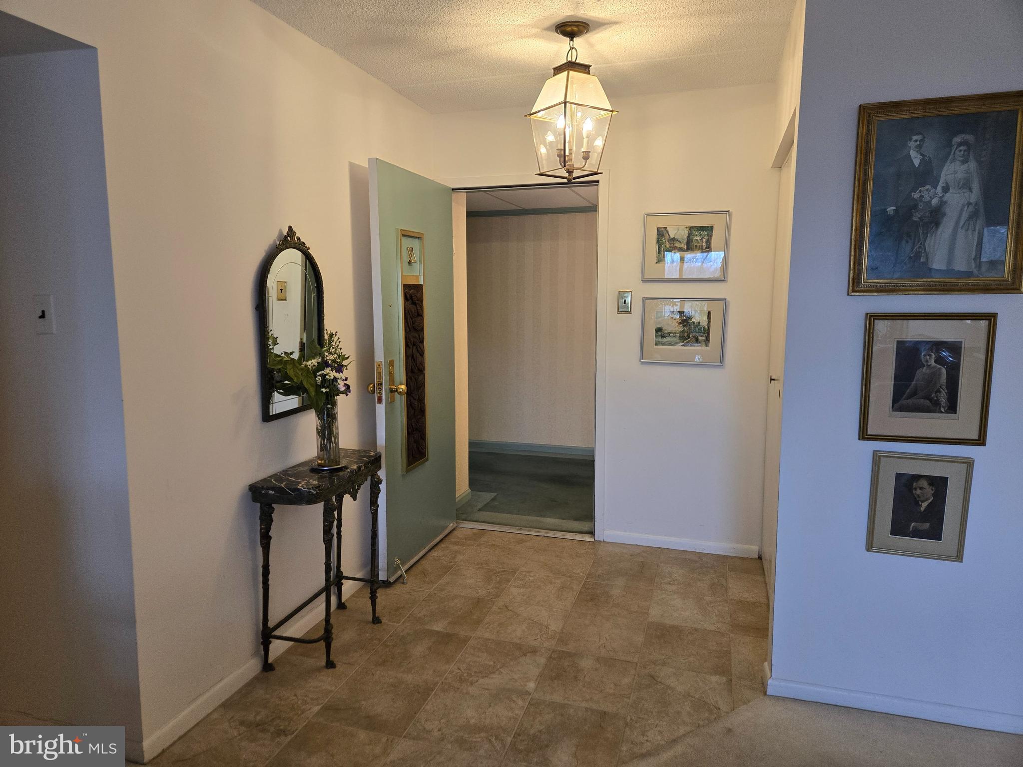 1000 Putnam Boulevard, Unit 603 Wallingford, PA 19086 - Photo 10 of 44 a view of entryway with chandelier