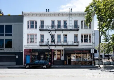 a front view of a large building and a street