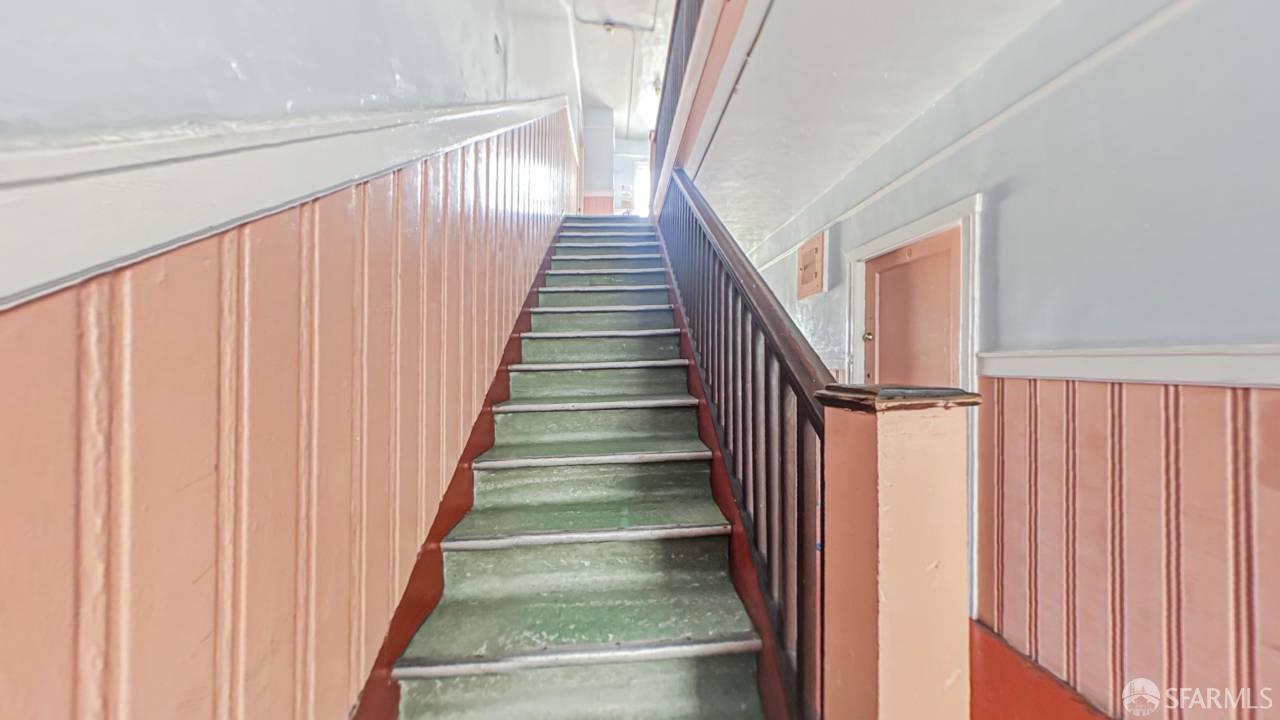 480-484 6th Street San Francisco, CA 94103 - Photo 25 of 52 a view of staircase with railing and white walls