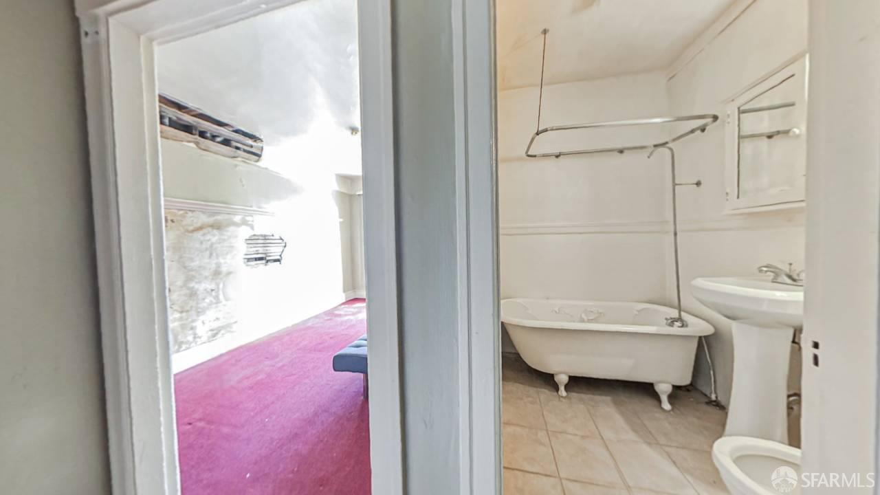 480-484 6th Street San Francisco, CA 94103 - Photo 27 of 52 a bathroom with a granite countertop toilet sink and shower