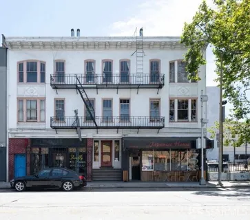 a front view of a building with glass windows