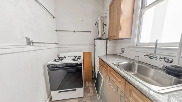 a kitchen with a sink and a stove