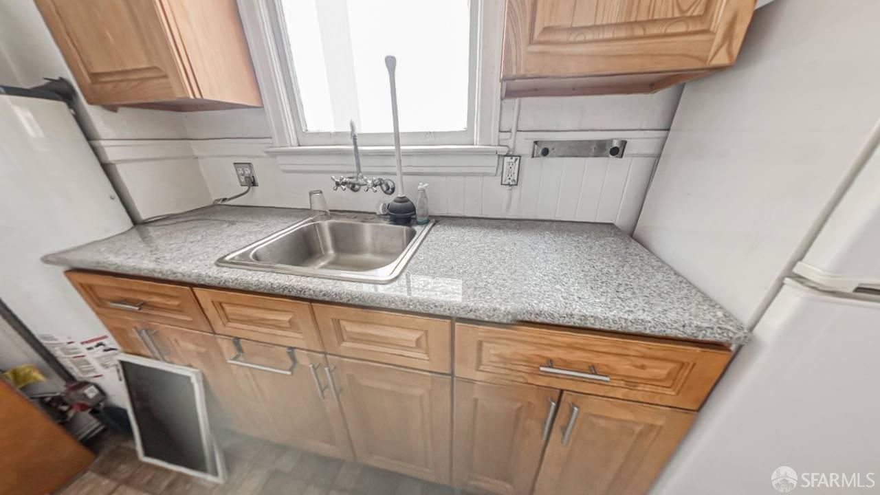 480-484 6th Street San Francisco, CA 94103 - Photo 33 of 52 a kitchen with a sink and a window