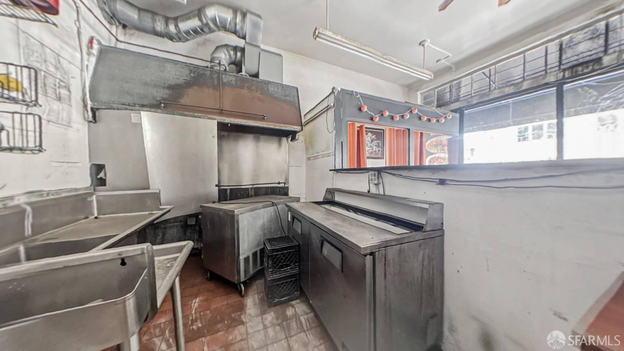 480-484 6th Street San Francisco, CA 94103 - Photo 37 of 52 a kitchen with stainless steel appliances a sink stove and cabinets
