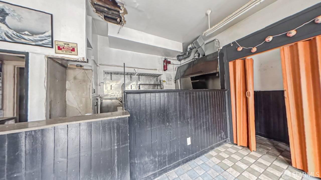480-484 6th Street San Francisco, CA 94103 - Photo 38 of 52 a view of a hallway with wooden floor and staircase