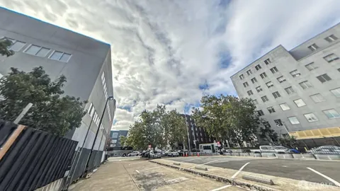 a view of a house with a wooden fence