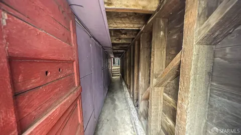 a view of a hallway with stairs