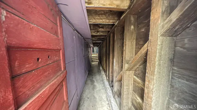a view of a hallway with stairs