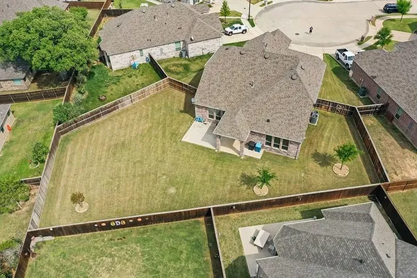 an aerial view of residential house with pool