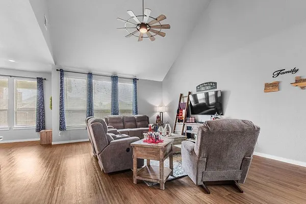 a kitchen with granite countertop kitchen island stainless steel appliances a stove a sink a refrigerator and cabinets