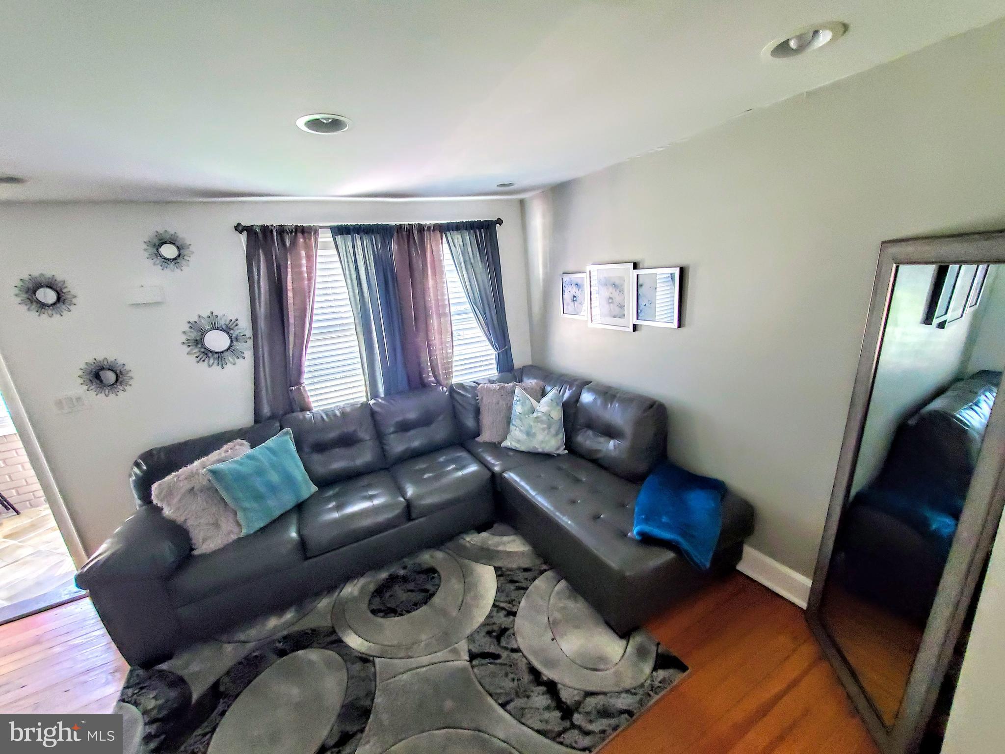 3083 South Congress Road Camden, NJ 08104 - Photo 5 of 22 Comfy living room with original hardwood floors