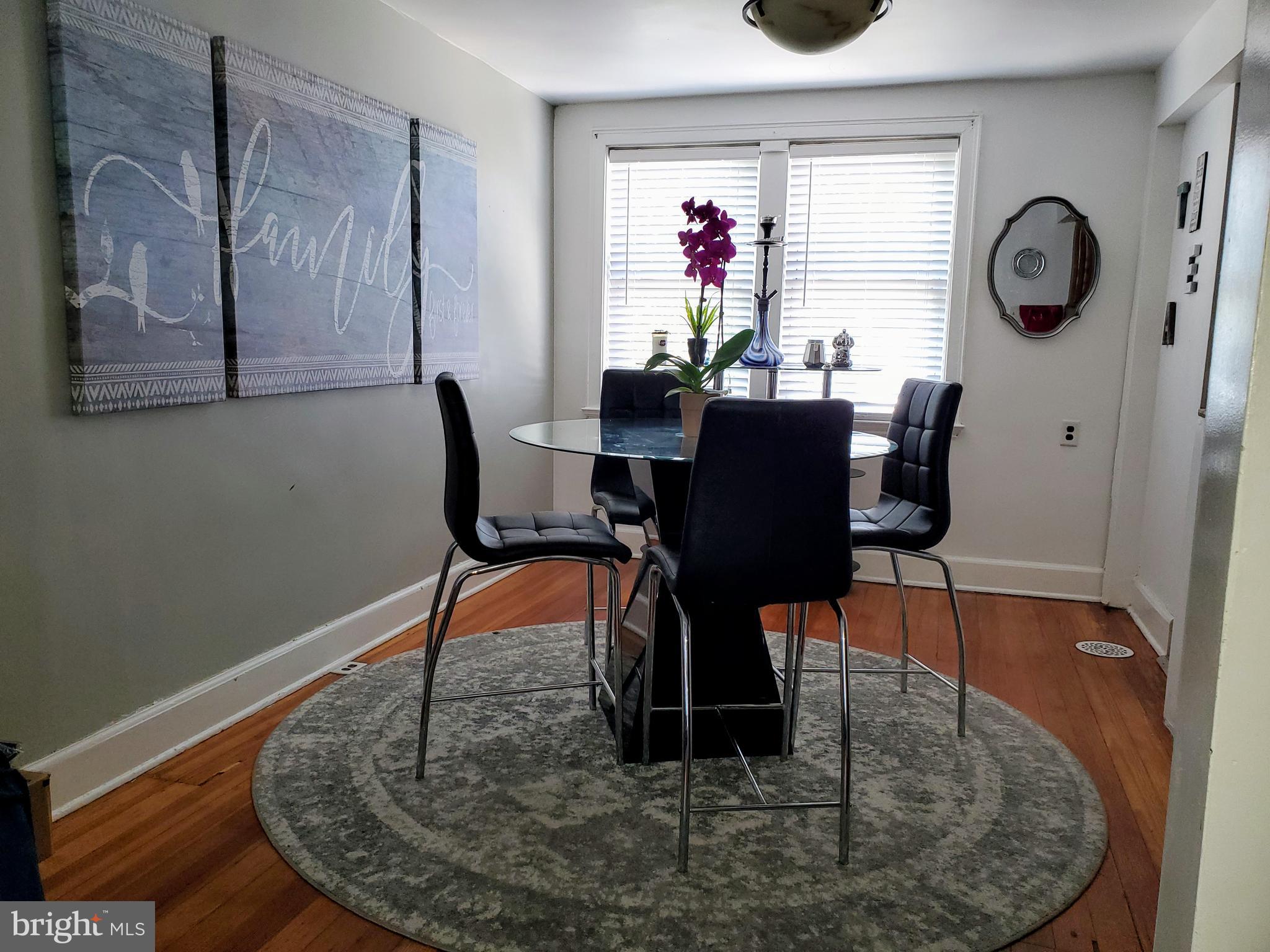 3083 South Congress Road Camden, NJ 08104 - Photo 9 of 22 Dining rm with bright windows & original h/w floor