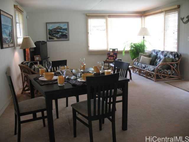 3001 Numana Road Honolulu, HI 96819 - Photo 1 of 1 a dining room with furniture and a large window