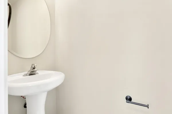 a bathroom with a sink and mirror