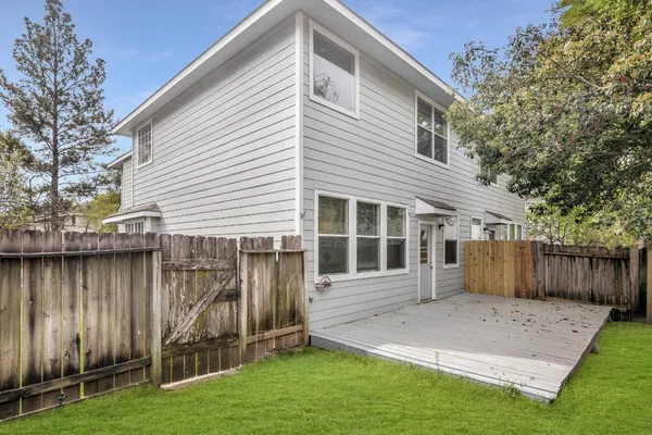 a front view of a house with a yard and a garage