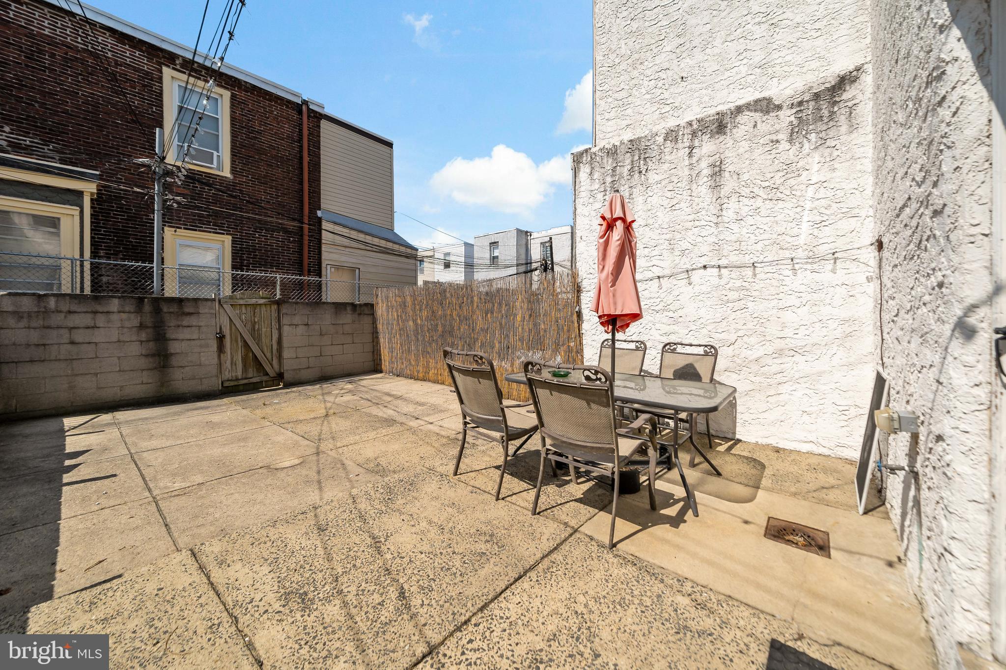 1304 Jackson Street, Unit 1 Philadelphia, PA 19148 - Photo 14 of 17 a view of a patio with a table and chairs