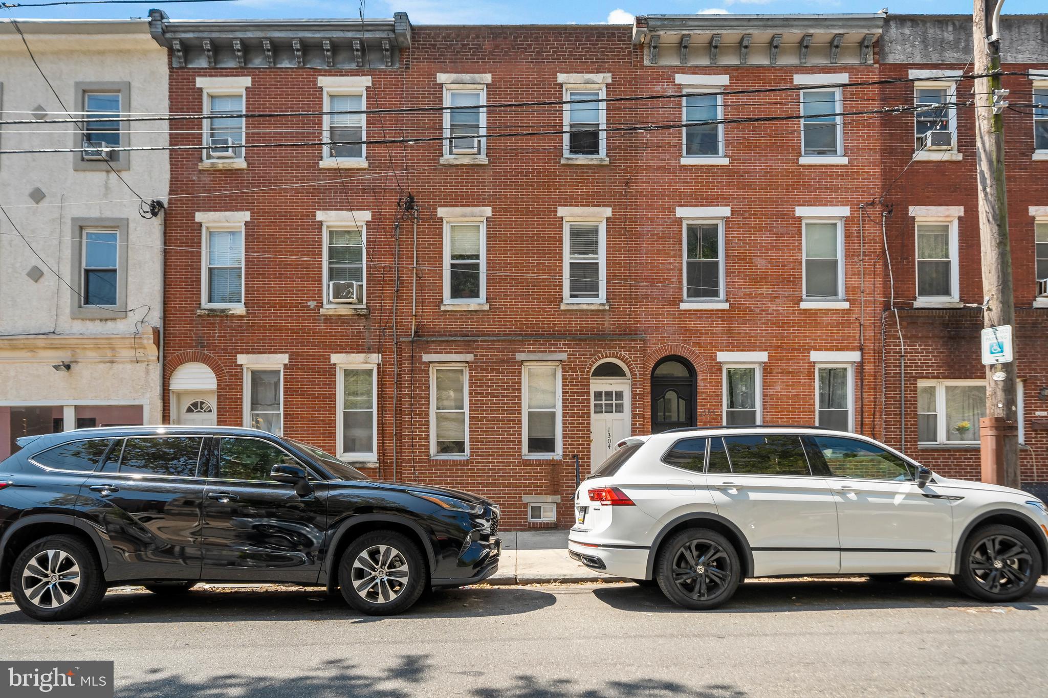 1304 Jackson Street, Unit 1 Philadelphia, PA 19148 - Photo 17 of 17 a car parked in front of a building