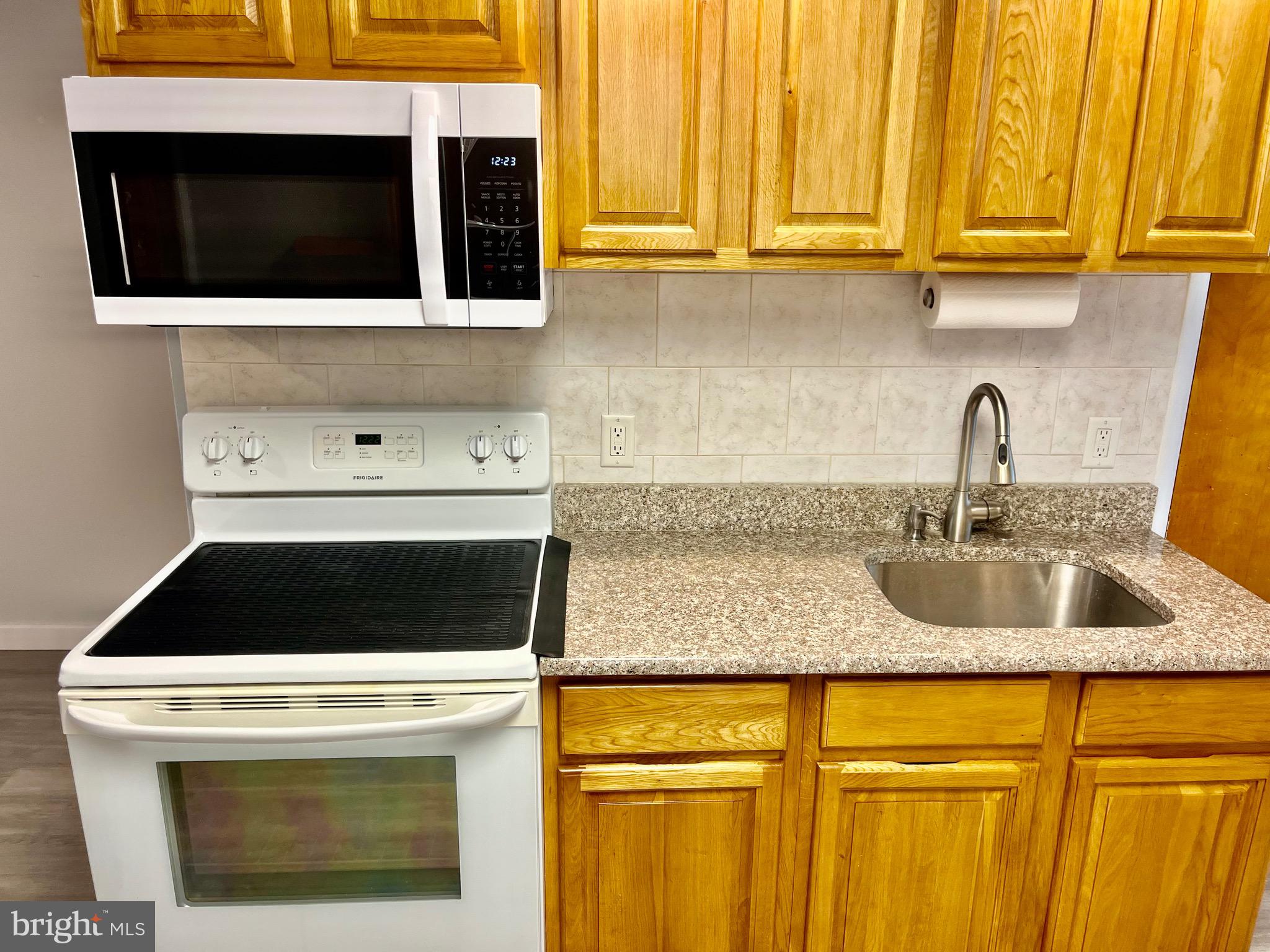1304 Jackson Street, Unit 1 Philadelphia, PA 19148 - Photo 4 of 17 a kitchen with a sink and cabinets