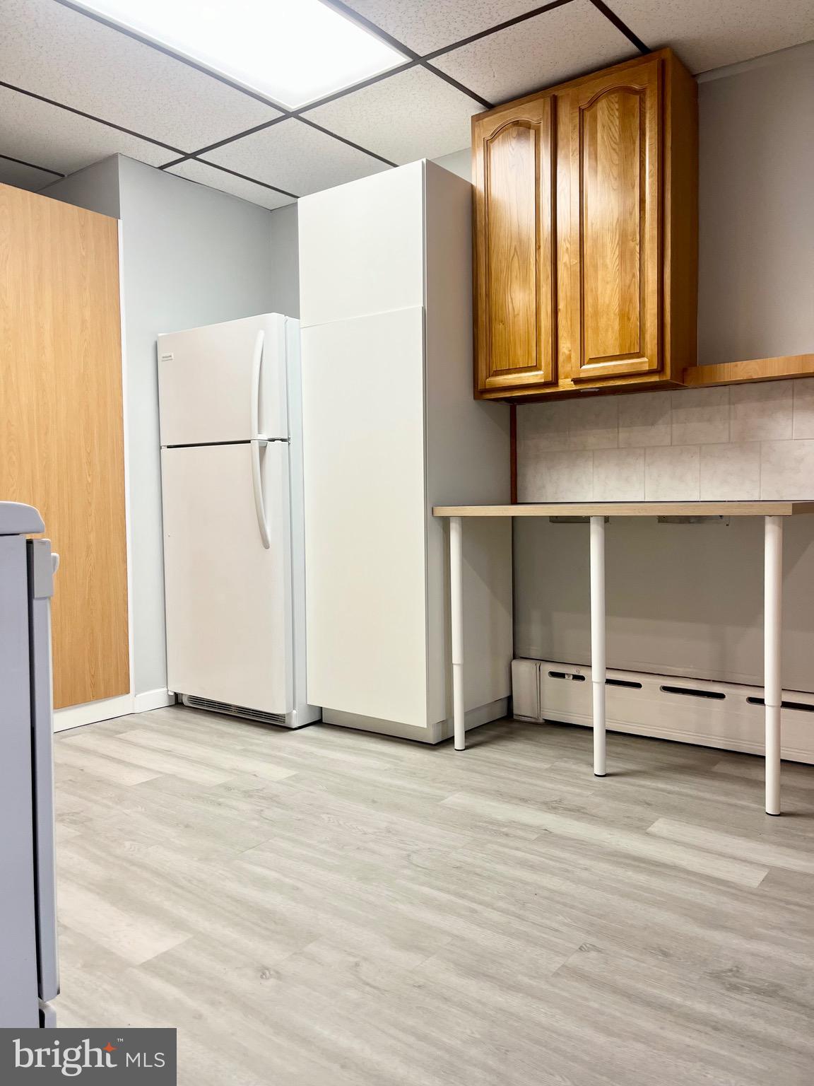 1304 Jackson Street, Unit 1 Philadelphia, PA 19148 - Photo 5 of 17 a view of an empty room with wooden floor and a window