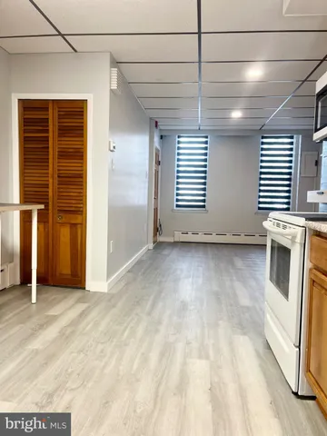 a view of an empty room with a window