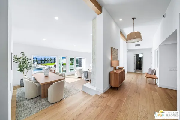 a kitchen with a center island cabinets and wooden floor