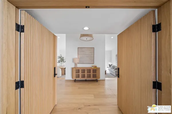 a bed room with a bed and a chair