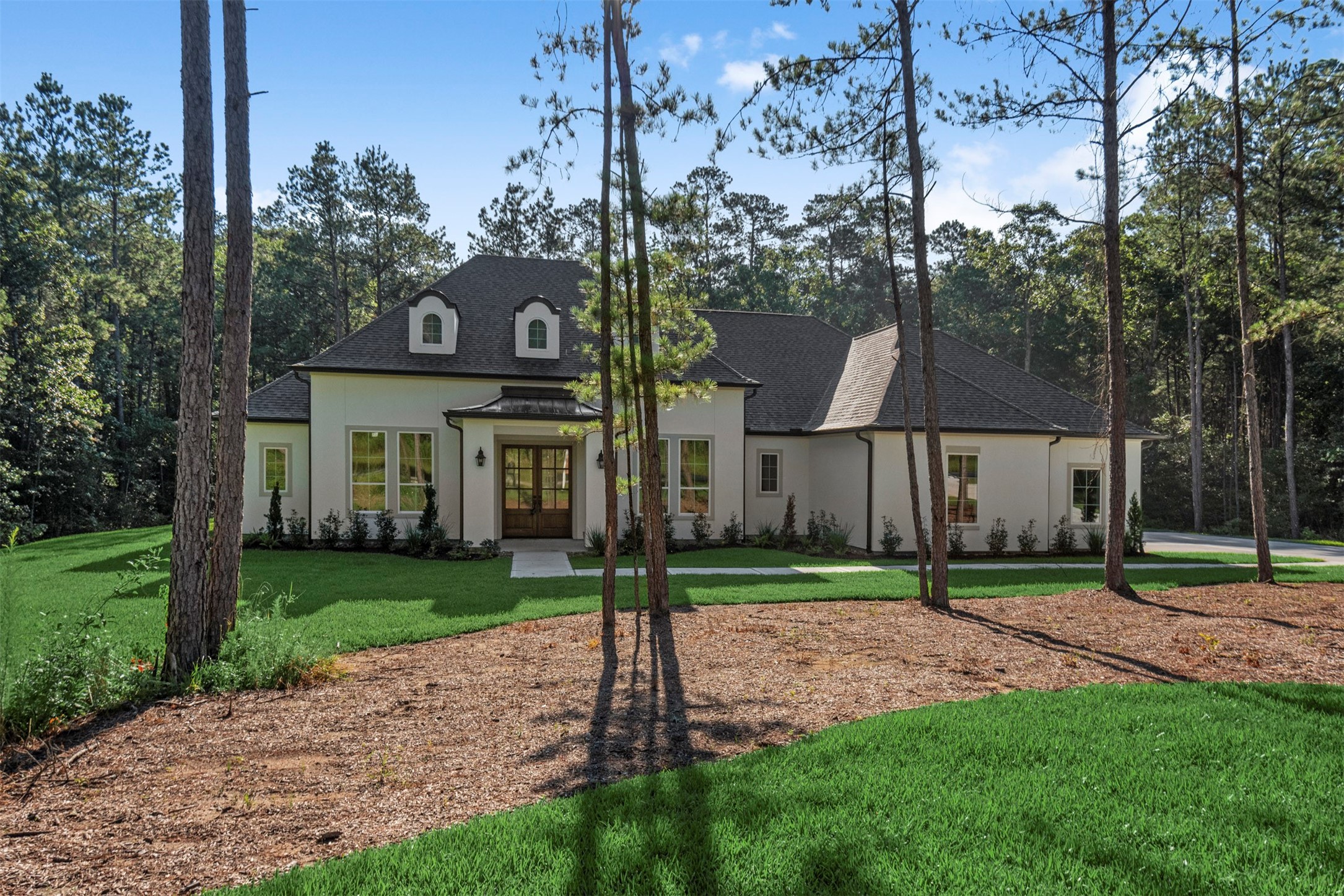 Custom French inspired beauty by Royal Texan Homes on a sprawling 1.6 acres in gorgeous Texas Grand Ranch.