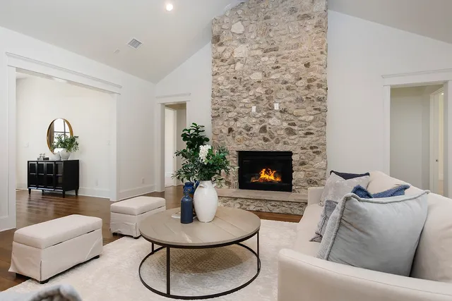 a living room with furniture and potted plant