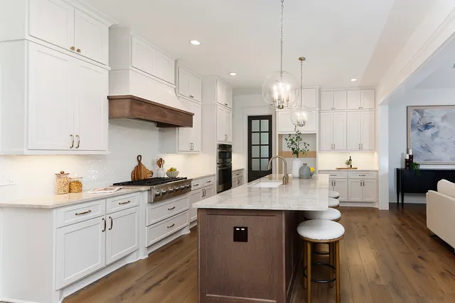 a view of a kitchen and dining table chairs
