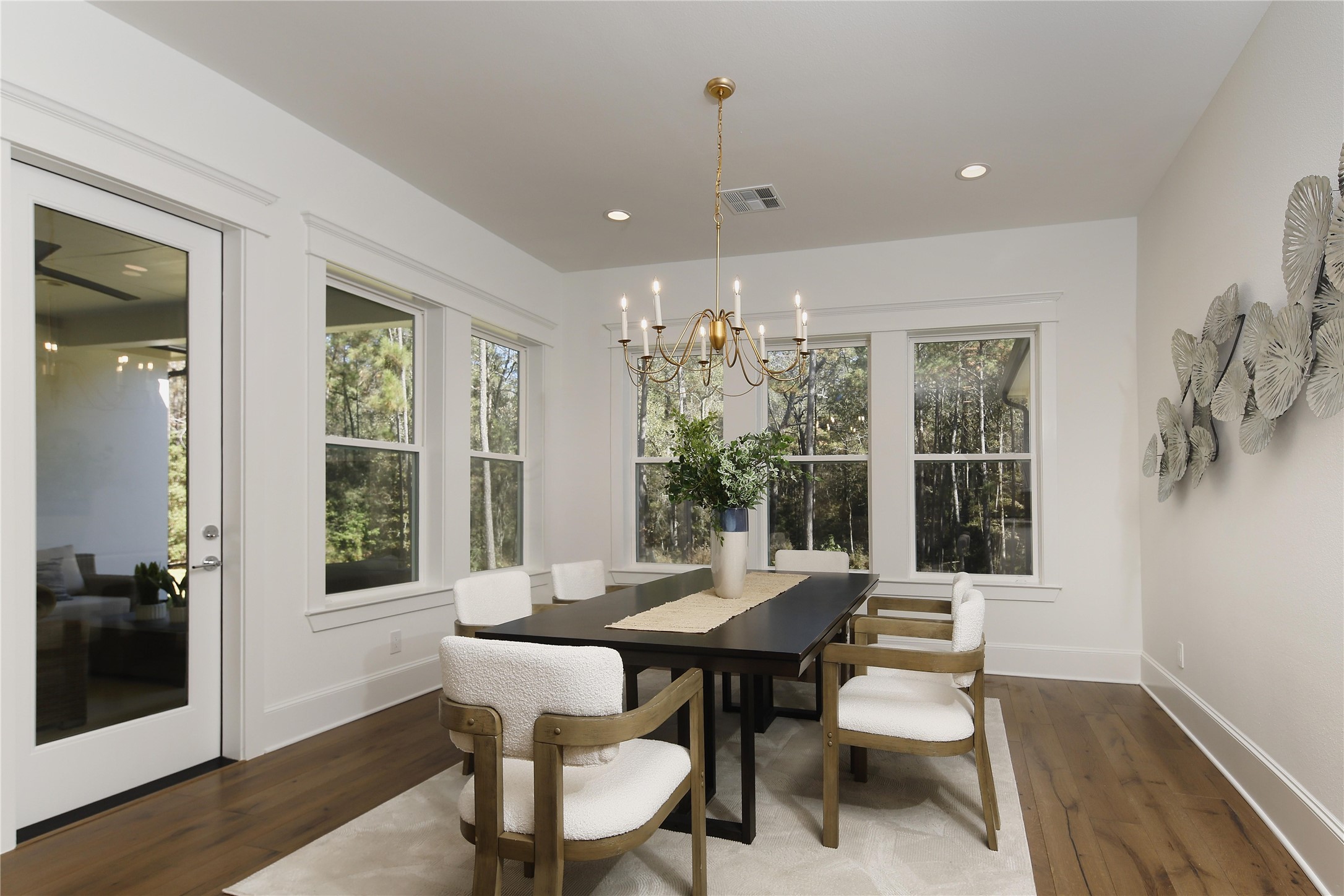630 Lonestar Road Huntsville, TX 77340 - Photo 23 of 48 The large dining room has wonderful windows/door with beautiful views of the backyard.