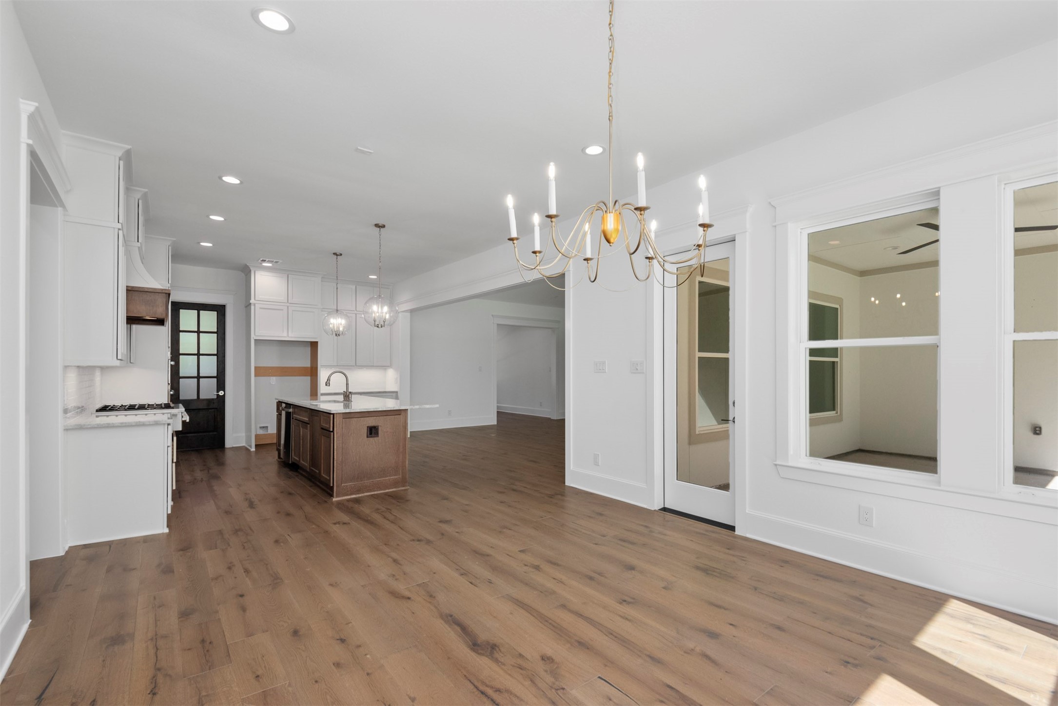 630 Lonestar Road Huntsville, TX 77340 - Photo 24 of 48 a view of a kitchen and dining table chairs