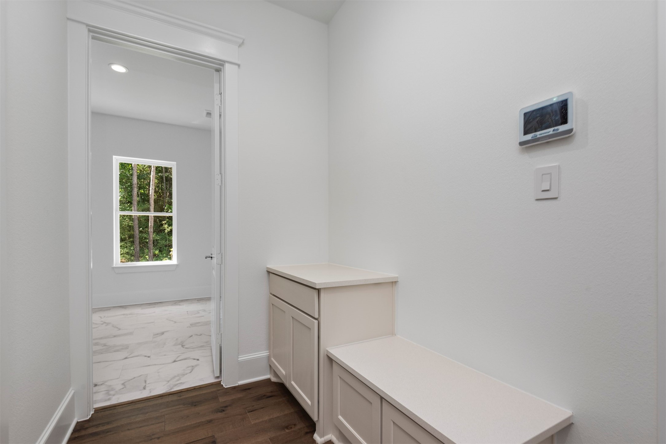 630 Lonestar Road Huntsville, TX 77340 - Photo 25 of 48 Convenient built-in drop-zone as you enter the home from the garage. The room in the background is the laundry room.
