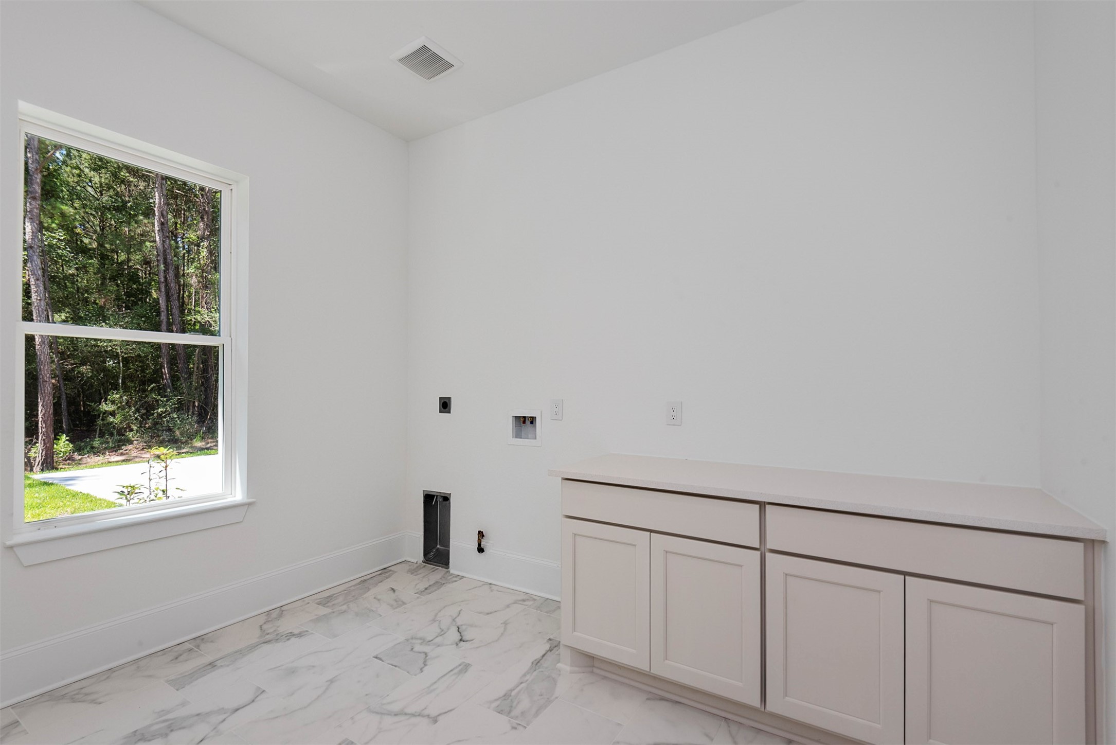 630 Lonestar Road Huntsville, TX 77340 - Photo 26 of 48 a view of a livingroom with an empty space and window