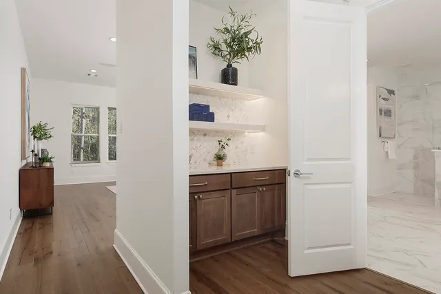a bathroom with a shower a toilet and a tub